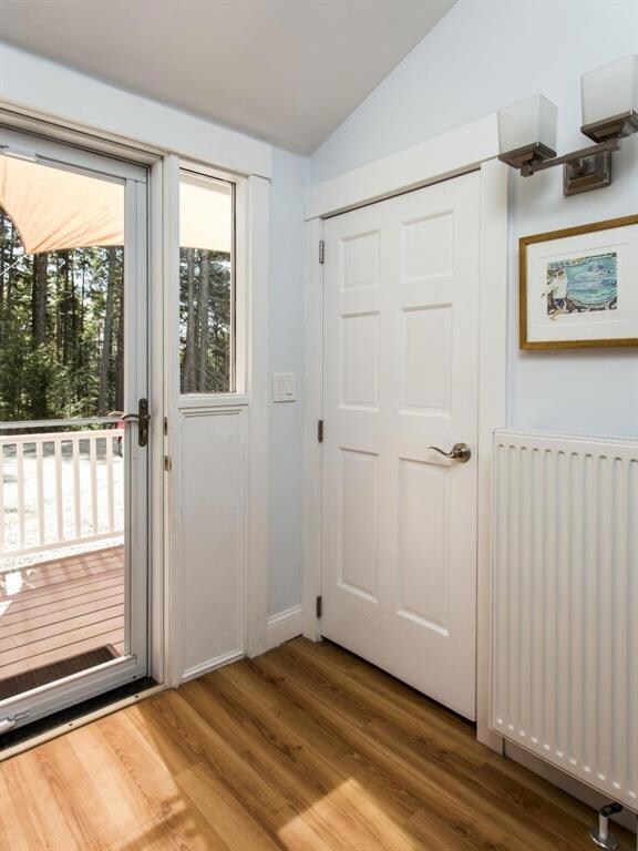 The entry, with closets and laminate...