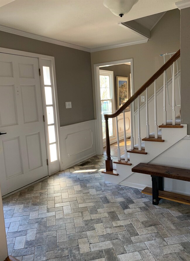 Entry with new flooring in foyer.