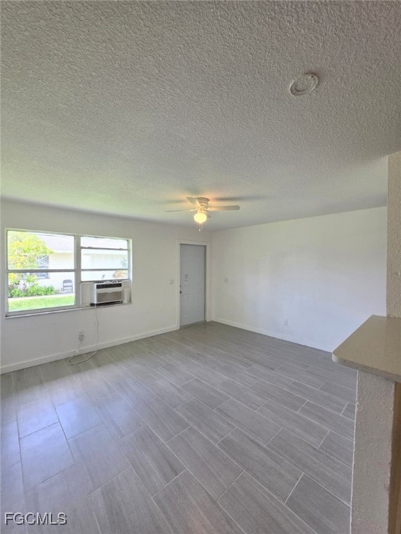 Spare room with ceiling fan and a textured ceiling