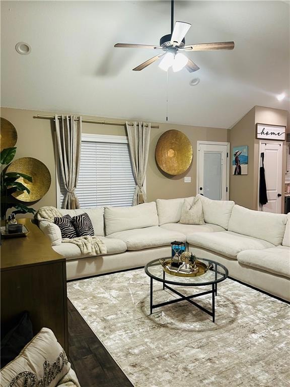 Living area with vaulted ceiling, dark wood finished floors, a ceiling fan, and recessed lighting