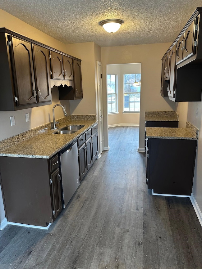Kitchen featuring dark hardwood / wood-style floor