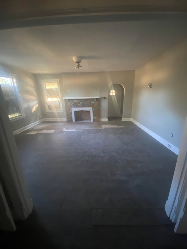 Interior space with a stone fireplace