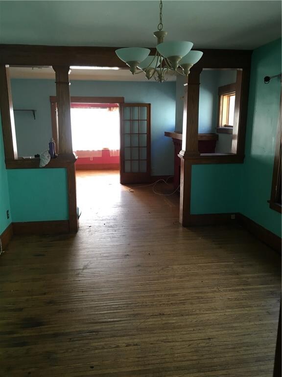 view into living room and additional room from din