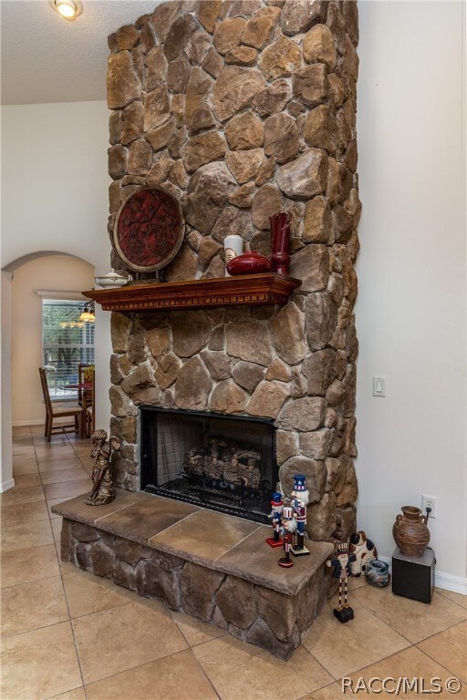 A grand, stone gas fireplace in the living room!