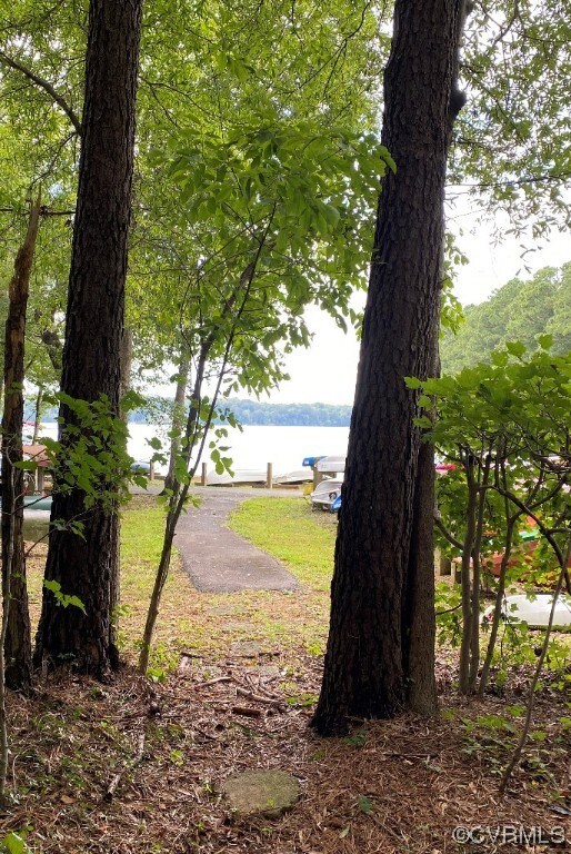 View of yard with a water view