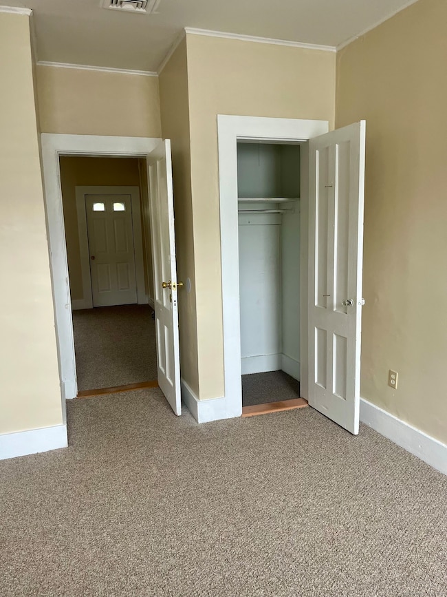 Second bedroom off of the living room with 1 closet!