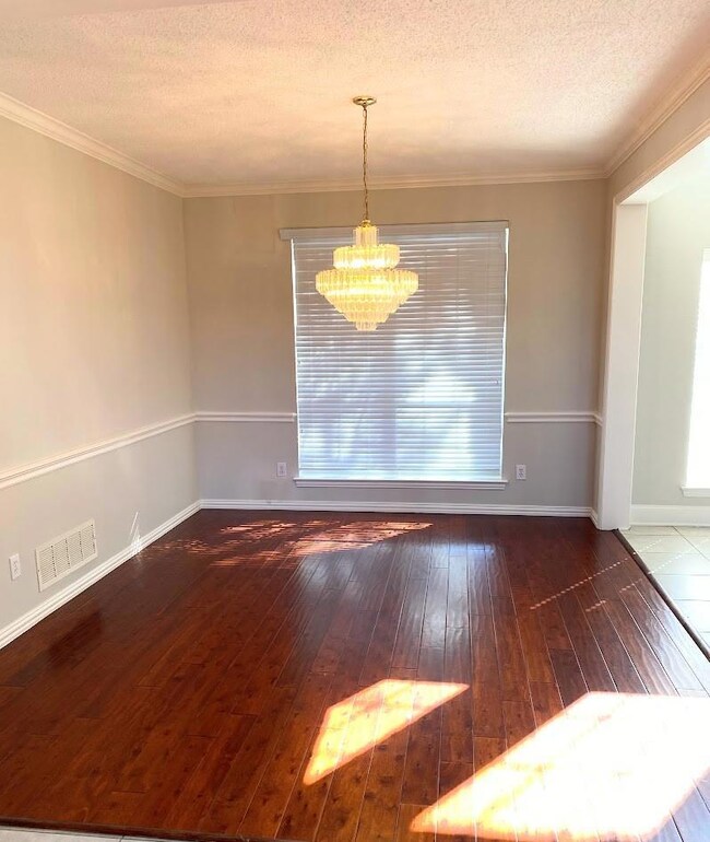 Formal dining with chandelier.