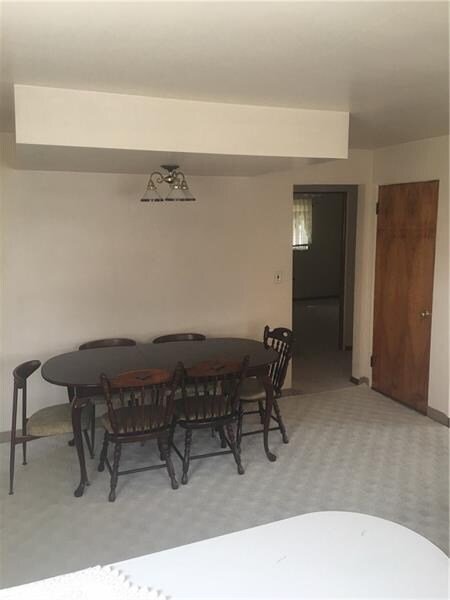 carpeted with a large area rug the conveniently lo