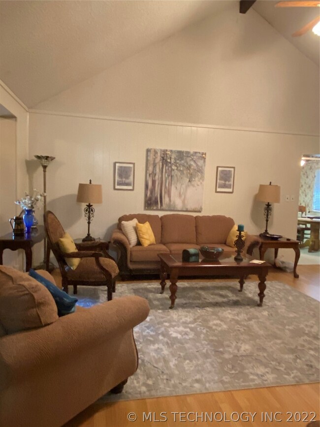LIVING AREA WITH VIEW OF BREAKFAST ROOM OFF TO THE
