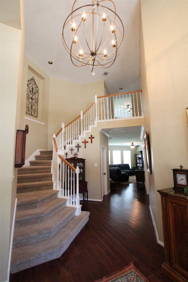 Upon entering the home, you will be amazed by the soaring ceiling, the statement light fixture, and the sweeping staircase.