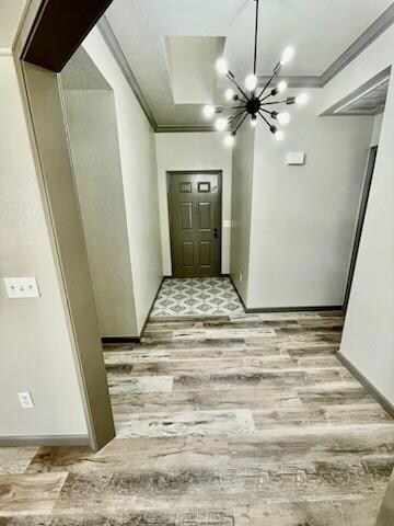 Hallway with light hardwood / wood-style flooring,