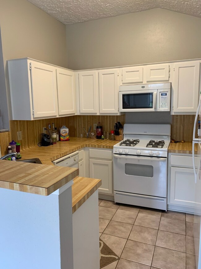 Light and bright kitchen with painted cabinets, easy care countertops, updated appliances and refrigerator included.