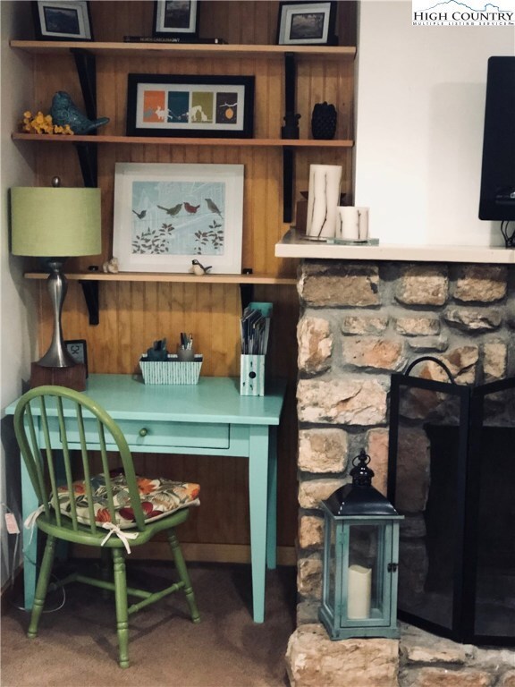 Cute look nook beside the cozy fireplace.