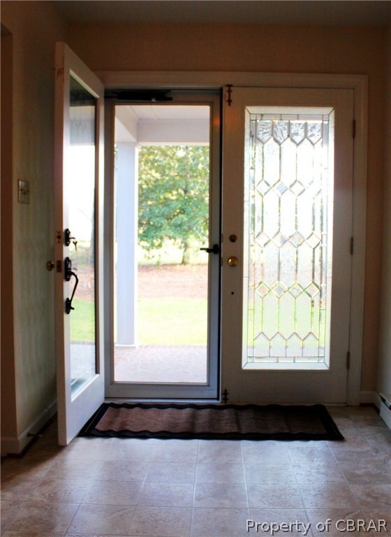 Lovely double doors open to wide, welcoming foyer.