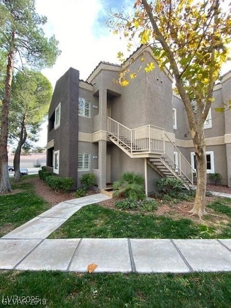 View of property featuring stairs