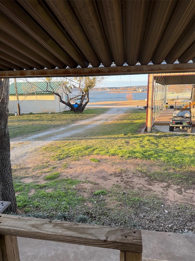 View of yard with lake views