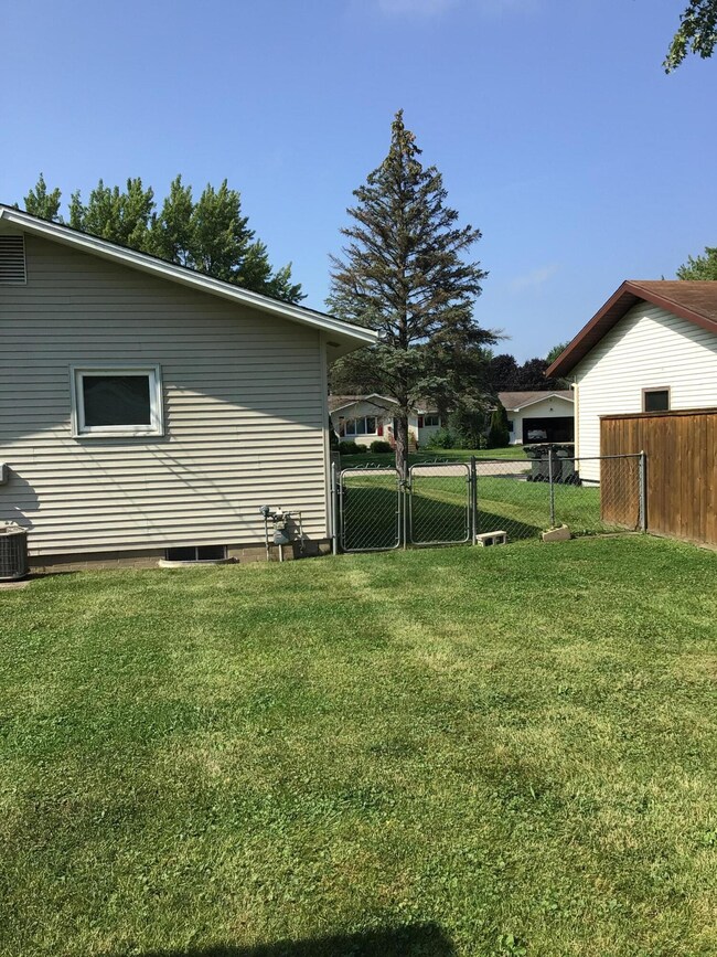 Back w/entrance gate to fenced area