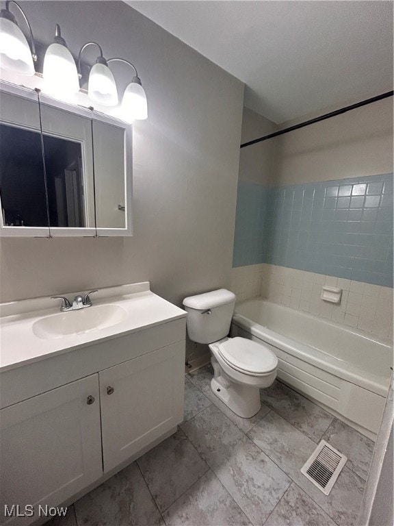 Bathroom featuring vanity and shower / bathtub combination