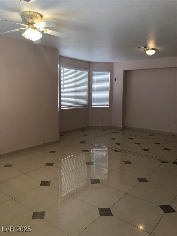 Unfurnished room with light tile patterned floors,