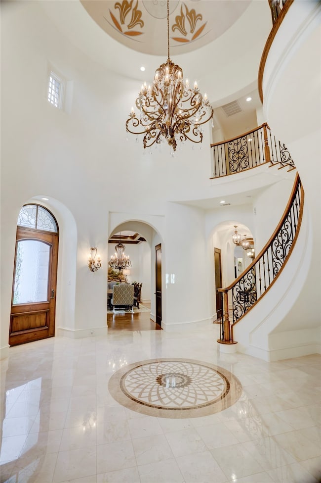 Grand rotunda entry with marble inlay floor, decor