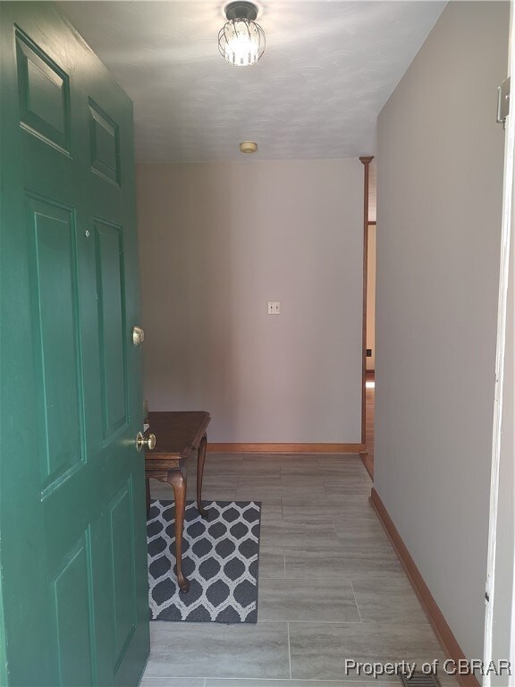 Entrance foyer featuring light hardwood / wood-style floors