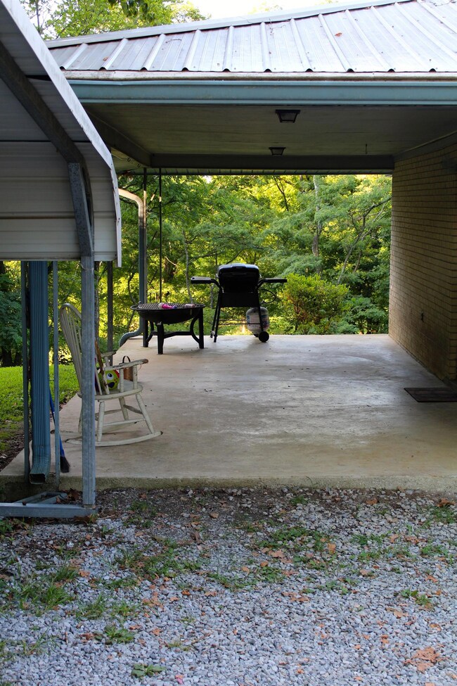 great covered patio on the side of the home