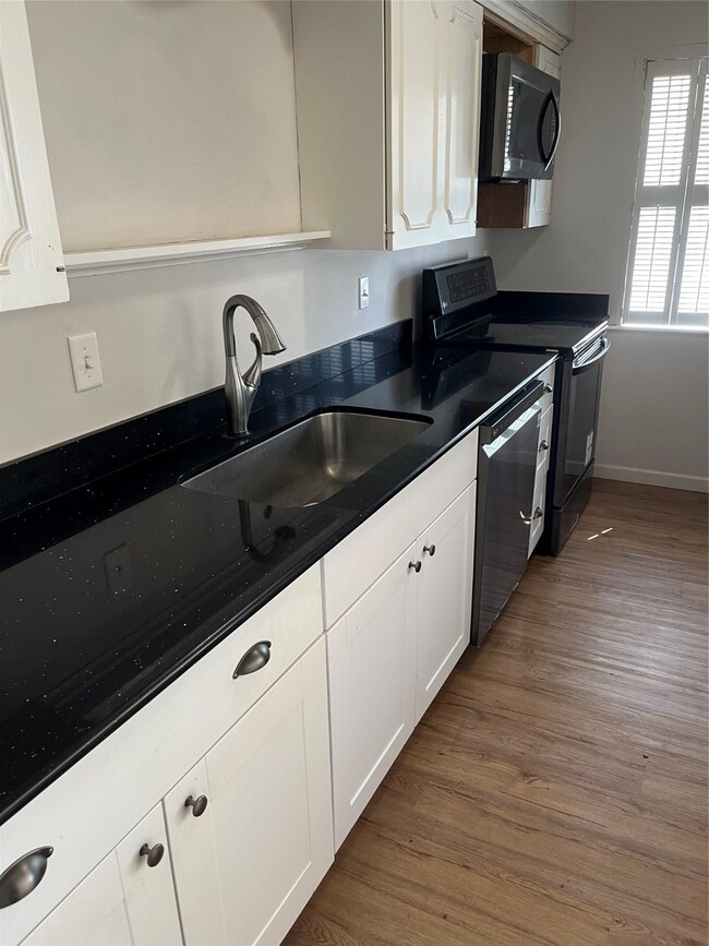 Kitchen with modern cabinets, soft close drawers,