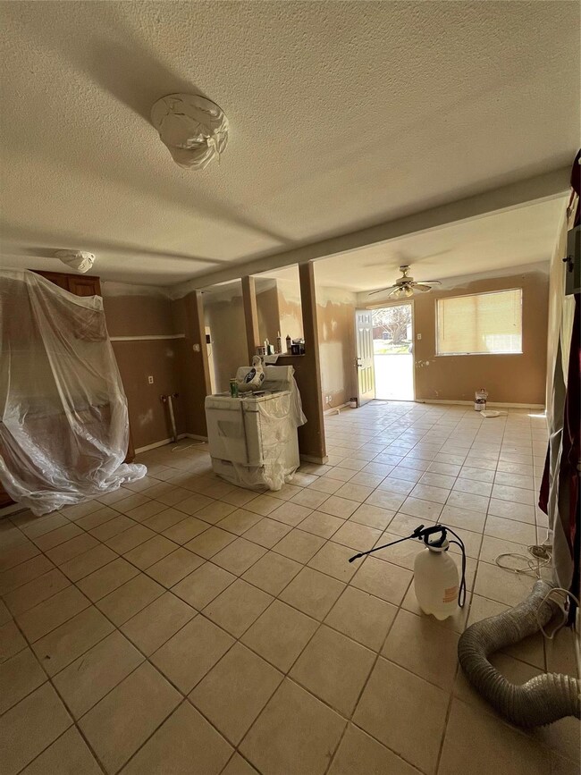Unfurnished living room with light tile patterned 