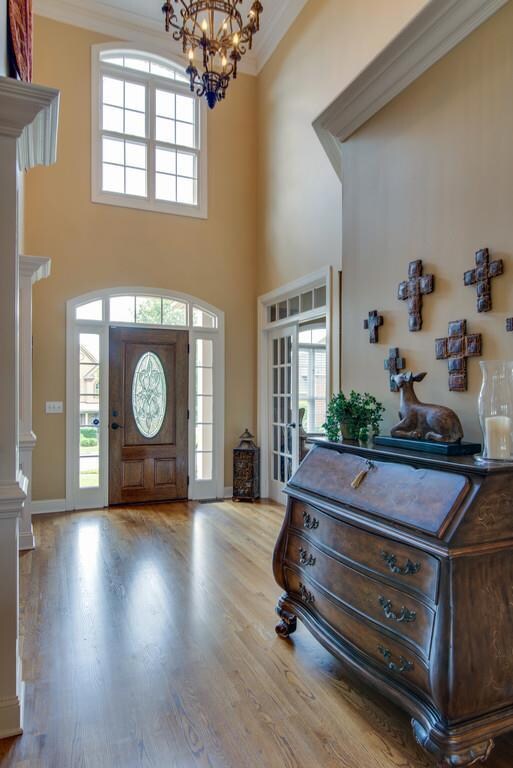 Peering from inside to get a different perspective of entry with tall ceilings