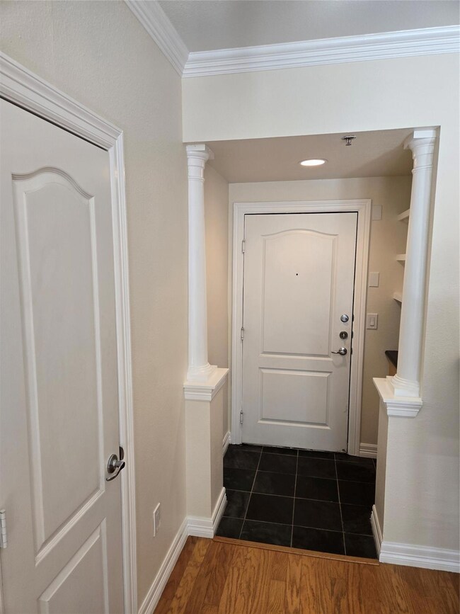 Looking towards front door, coat closet on left.