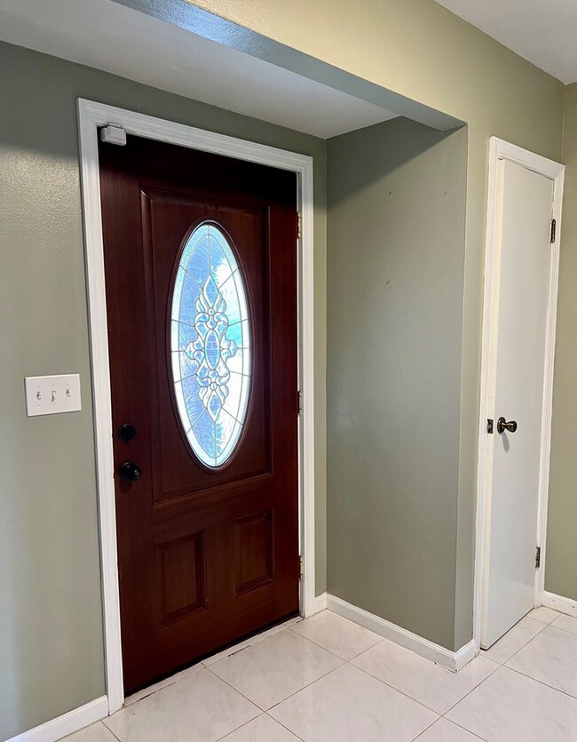 Front door and coat closet