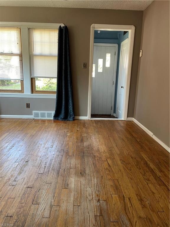 Living room and front entry.