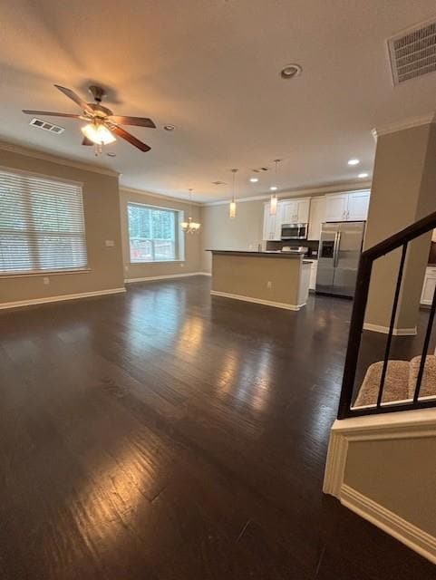 Unfurnished living room with ornamental molding, 
