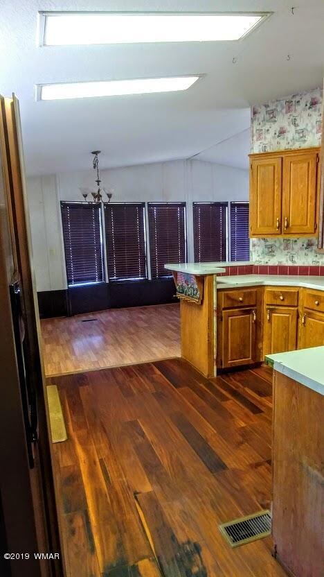 Kitchen opens to dining and living