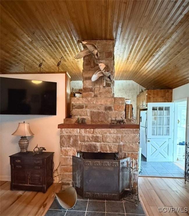 Living room featuring wood ceiling, vaulted ceilin
