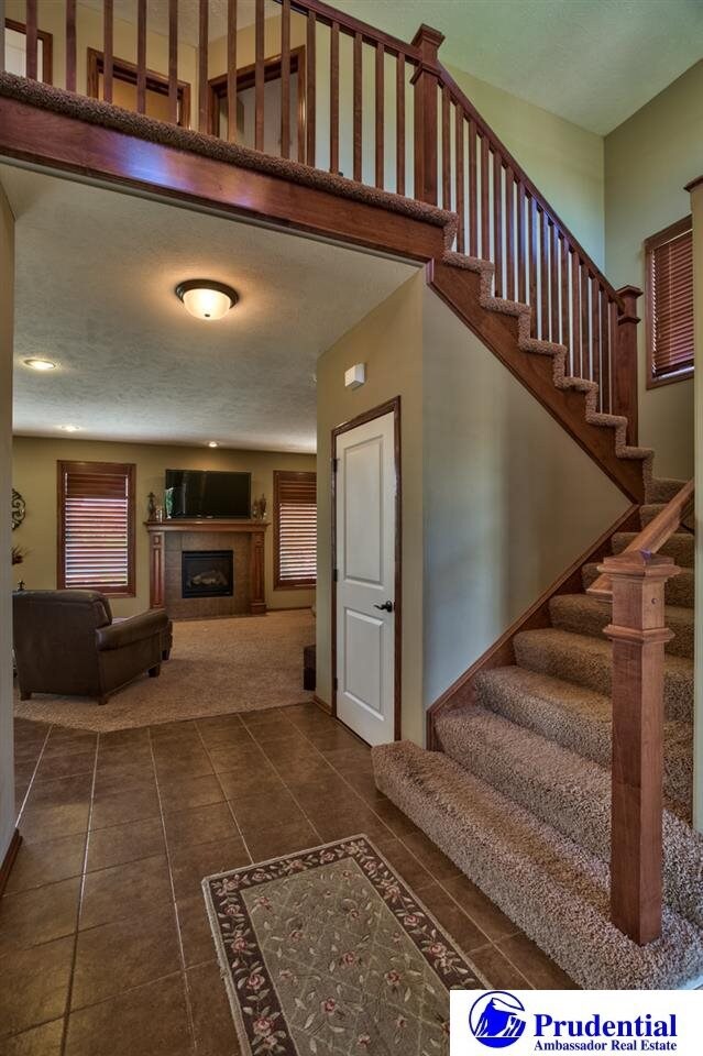 Tiled 2-story entry looking into the family room.  Extremely open.