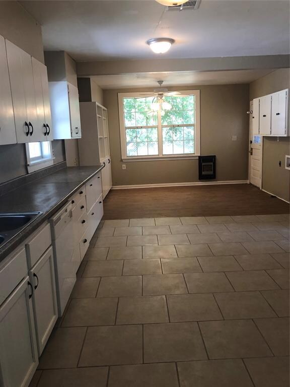 Large eat-in Kitchen featuring tile floors, white 