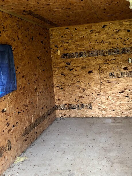 Inside bee shed/hives