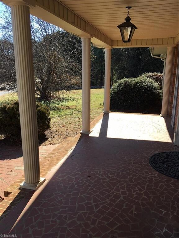 Front porch surrounded by columns.