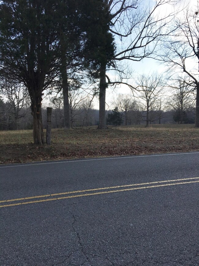 Watch the sun set off your rear deck on this wonderful tract of land
