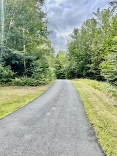 Long paved driveway for privacy