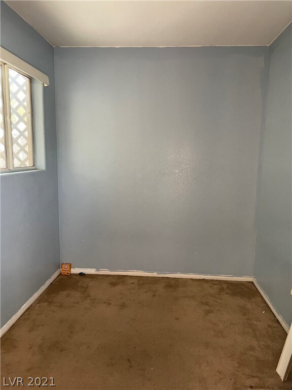 Den with window and door to backyard access