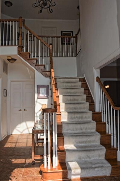 Dramatic entry is flooded with natural light and s