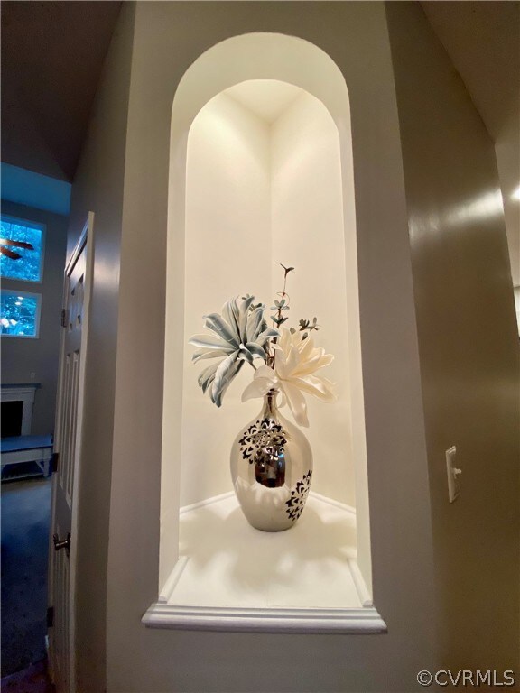 LIGHTED ALCOVE IN HALLWAY LEADING TO FAMILY ROOM