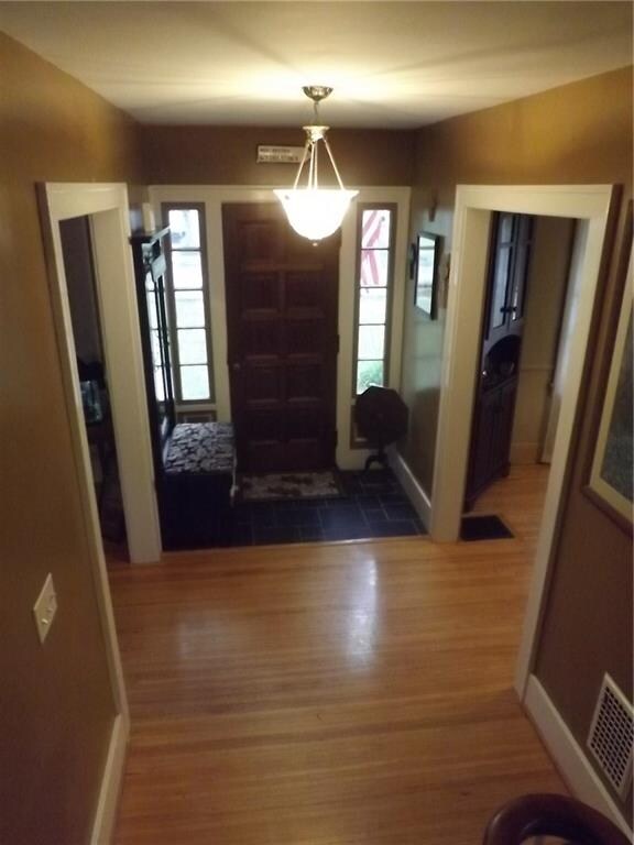 Foyer with old world charm that shows in the front