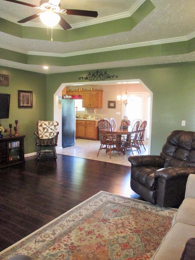 Living room opens to dining and kitchen area.