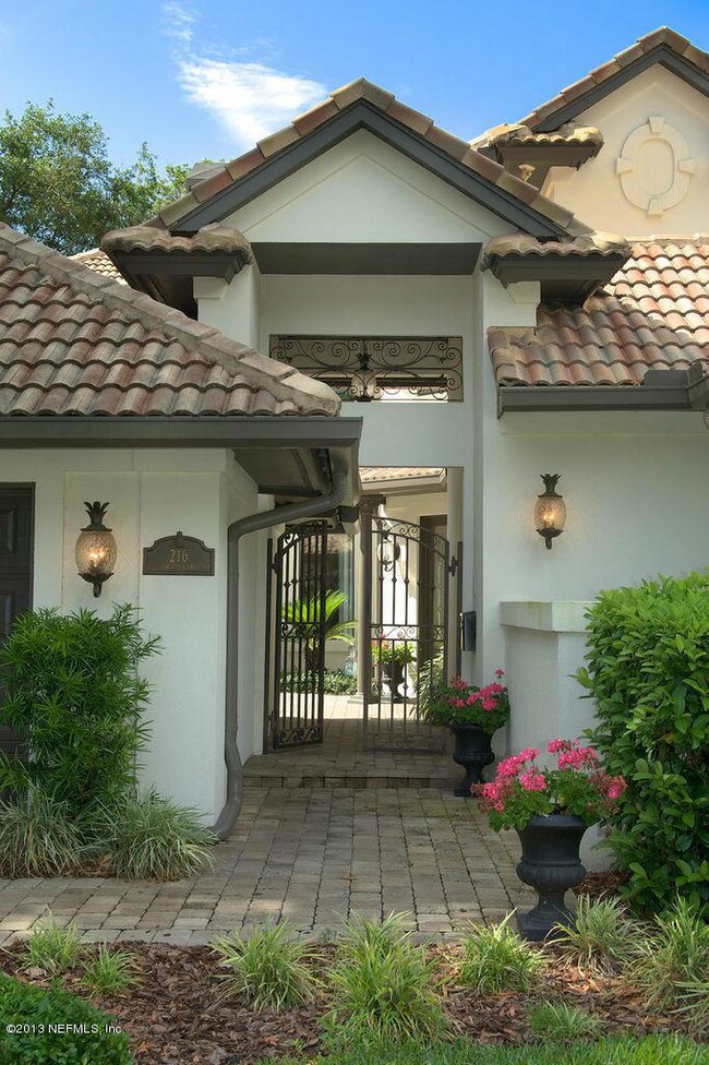 GATED ENTRY TO COURTYARD AND FRONT DOOR