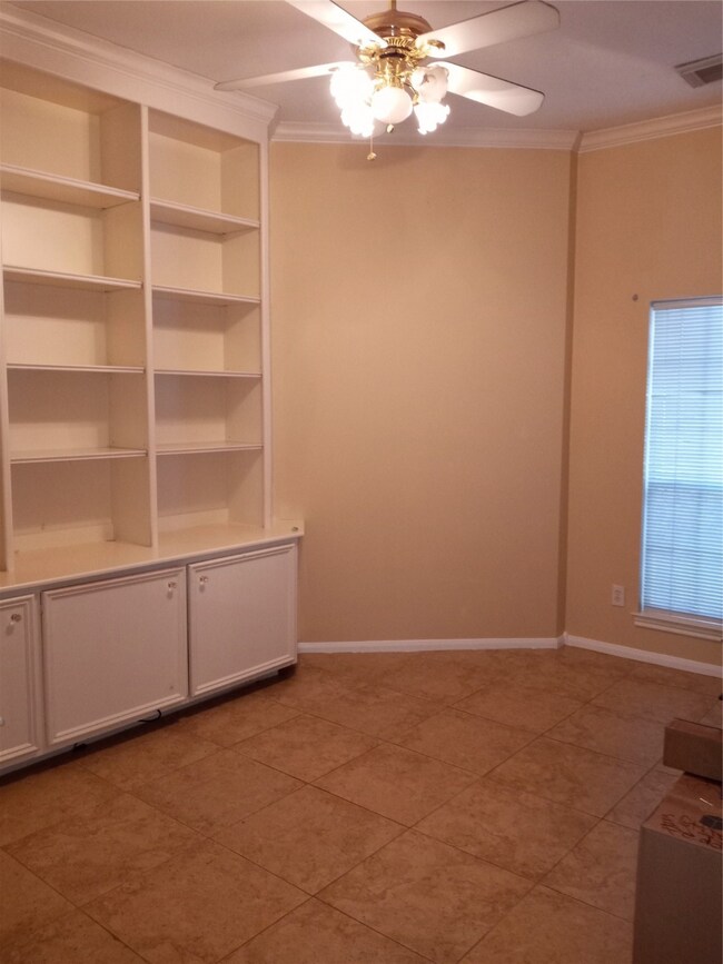 Library with floor to ceiling built in shelving
