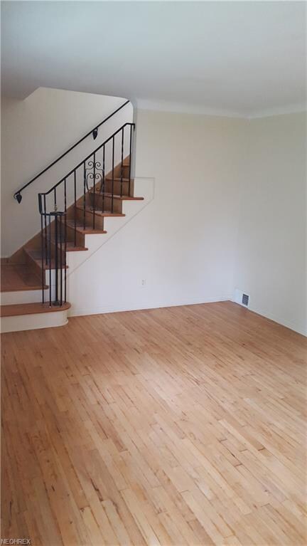 Spacious living room with a gorgeous hardwood floo