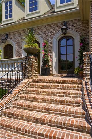 The grand brick stairway to your front porch is a formal entry to say the least. Adorned by gas lanterns and arched doors and windows, the front porch is a great space to relax and take in a good book, or as a gathering place for friends and family.